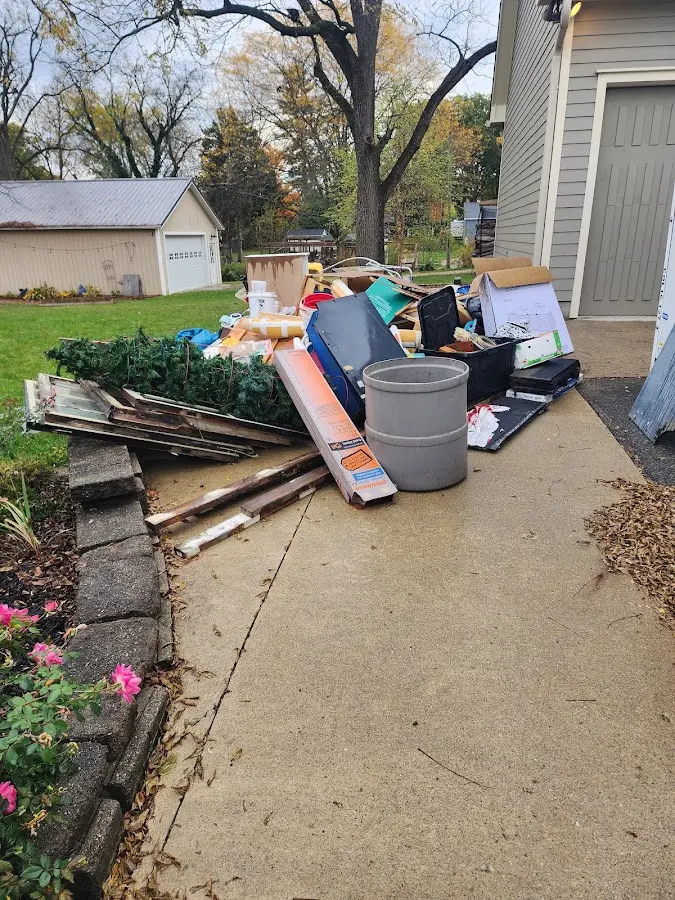 Dumpster being loaded with debris for Commercial Dumpster Rental in Scappoose